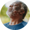 man looking up taking in a deep breath and smiling
